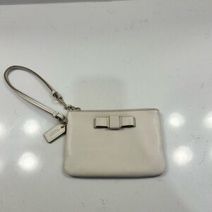 Coach Darcy Bow leather wristlet in white/cream with gold tone hardware